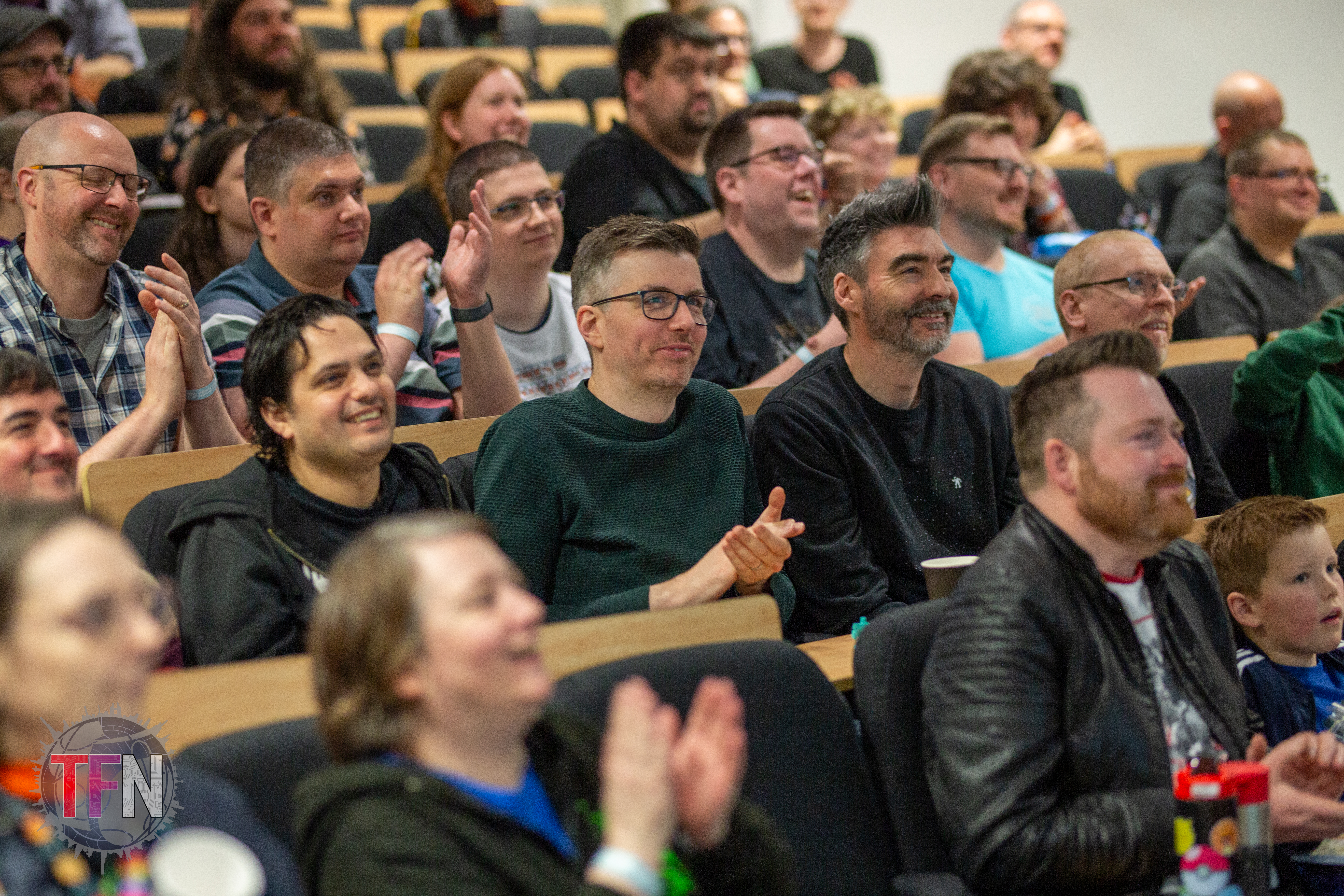 Attendees enjoying the vibes in the panel room